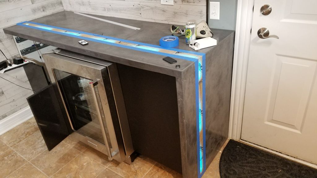 Encimera de Hormigón Tipo Cascada con Instalación de Luces LED