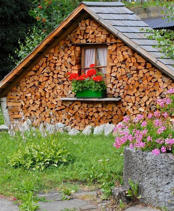 Natural outdoor houses built with logs and clay