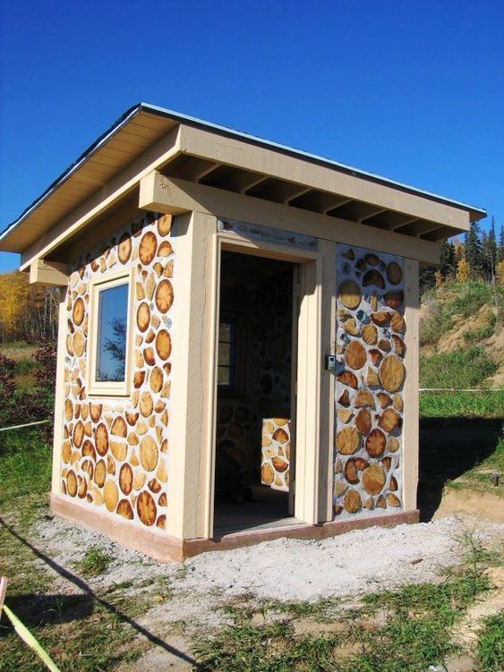 Natural outdoor houses built with logs and clay