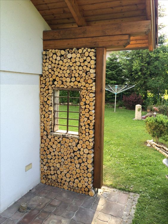 Natural outdoor houses built with logs and clay